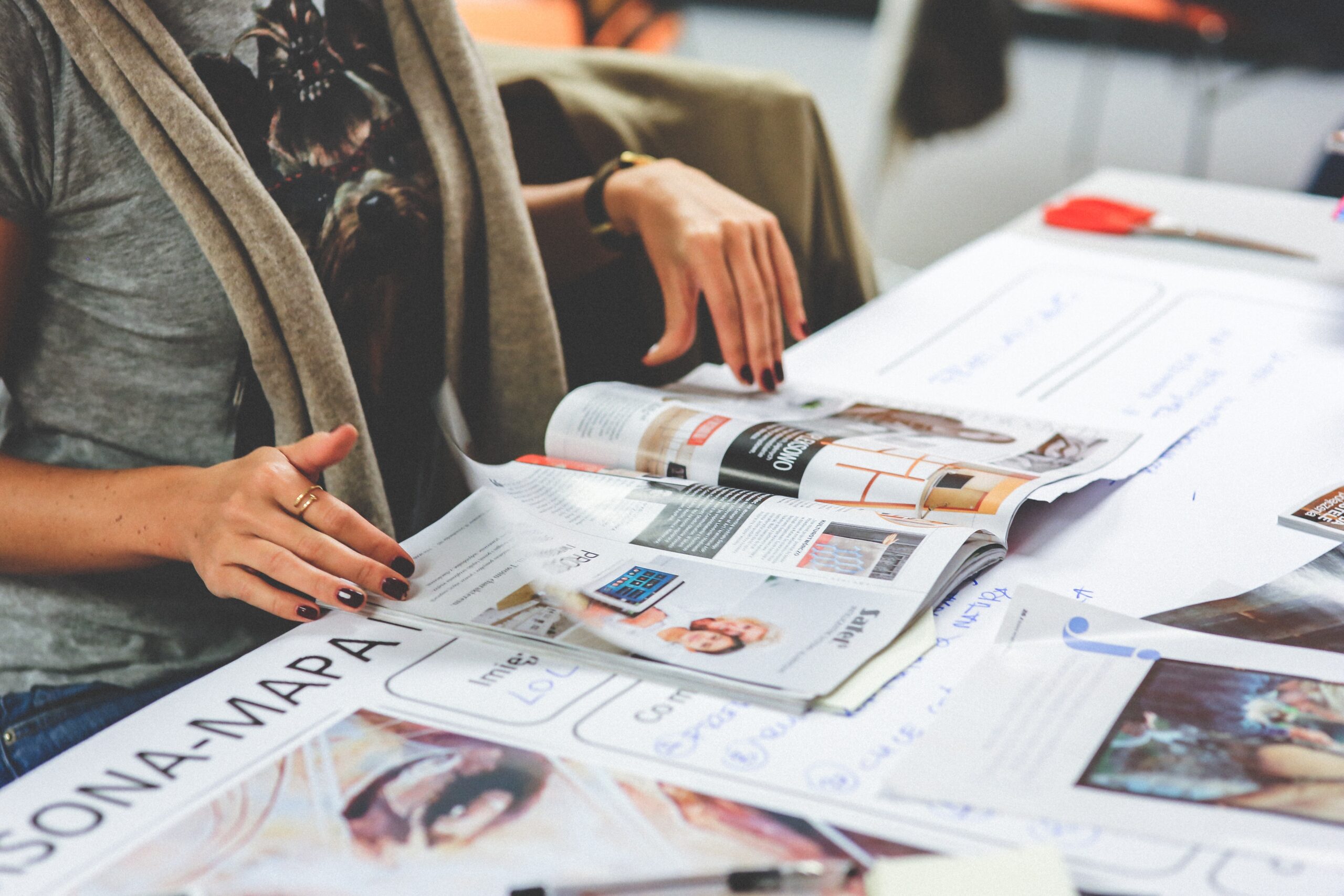 woman s hands with magazine scaled