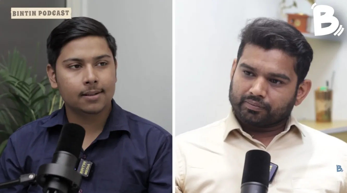Guest and host speaking into microphones in a Bintin podcast